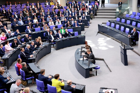 German Chancellor Friedrich Merz sits on the government bench