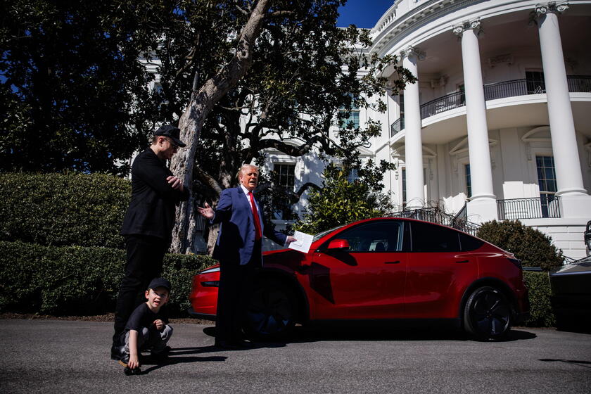 US President Trump views Tesla vehilces in front of the White House