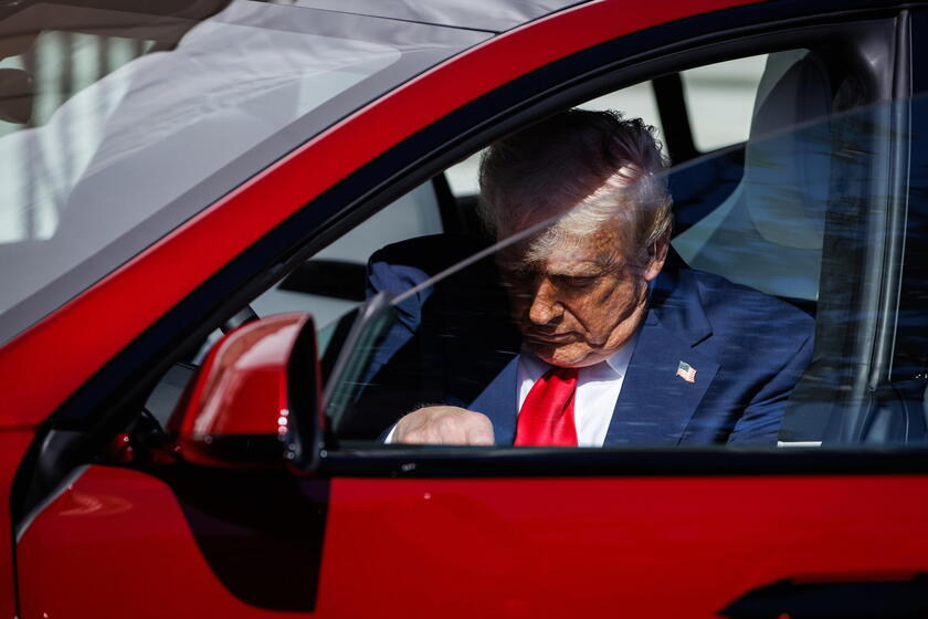 US President Trump views Tesla vehilces in front of the White House