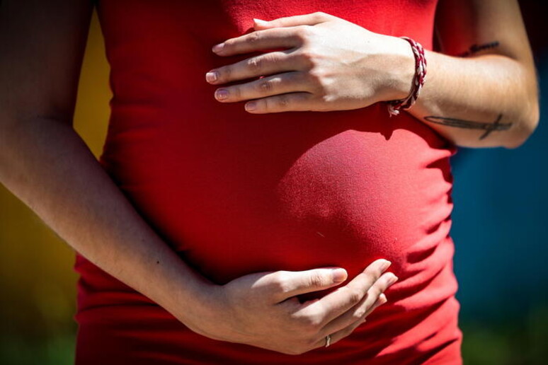 Una donna in gravidanza - RIPRODUZIONE RISERVATA