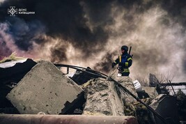 A firefighter working at the site of a Russian strike in Brovary, near Kyiv