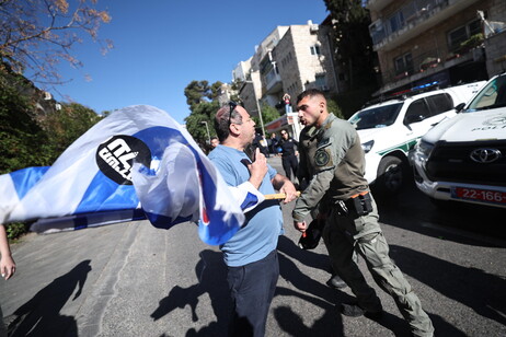 Police and demonstrators clash during a march to protest the resumption of fighting in Gaza