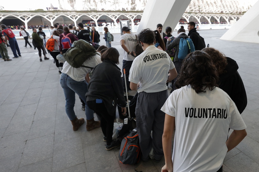 People volunteer to help people affected by flash floods in Valencia