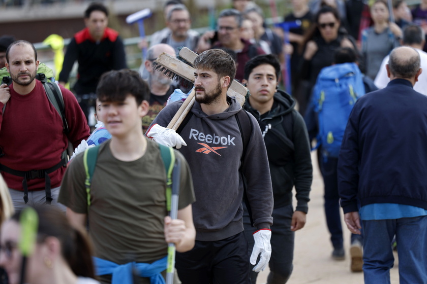 People volunteer to help people affected by flash floods in Valencia