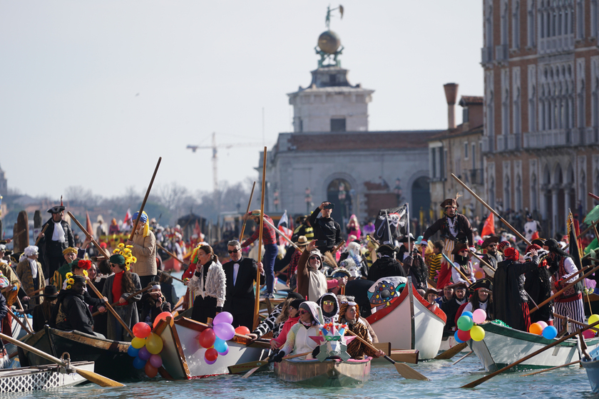 Venice carnival, reggata on the Grand Canal