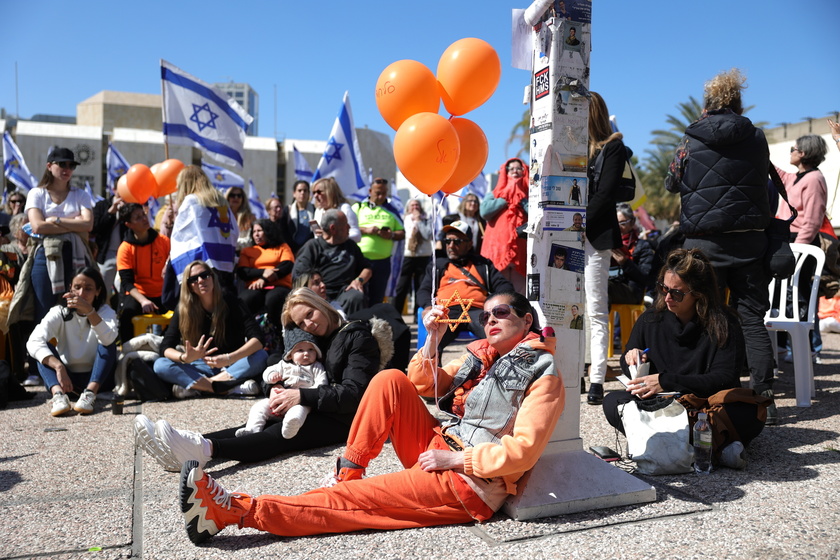 People gather in Tel Aviv to watch Bibas family funeral