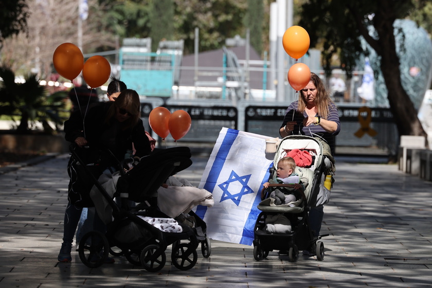 People gather in Tel Aviv to watch Bibas family funeral