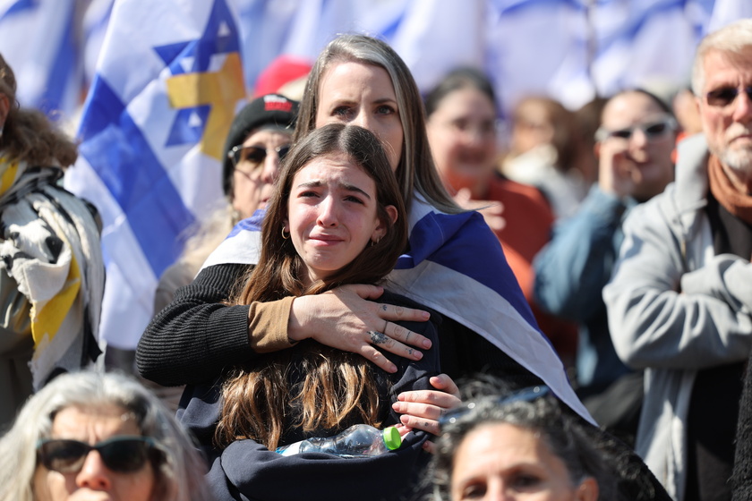 People gather in Tel Aviv to watch Bibas family funeral