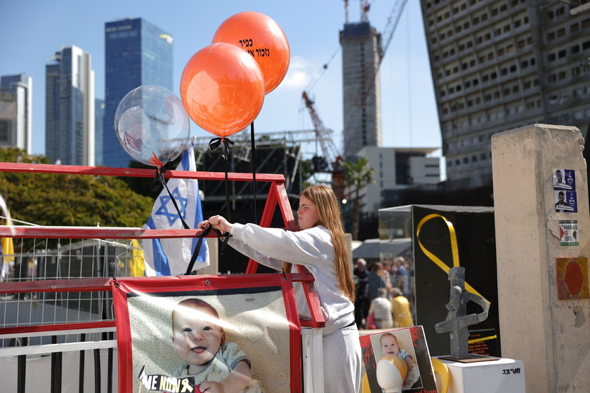 People gather in Tel Aviv to watch Bibas family funeral