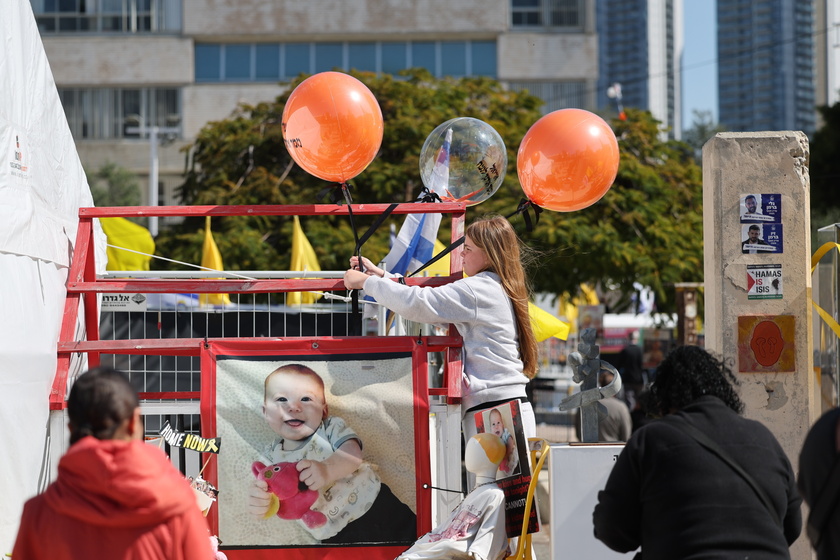 People gather in Tel Aviv to watch Bibas family funeral