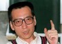 Ecco tre immagini d'archivio di Liu Xiaobo. Il premiato e' in carcere, non puo' incontrare nessuno, non puo' comunicare con l'esterno