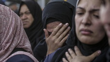 Palestinians mourn their dead at Deir Al Balah hospital after Israeli airstrike in central Gaza